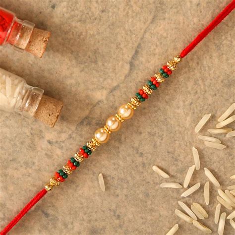 Send Traditional Pearl Studded Mauli Rakhi Online | Rakhibazaar.com