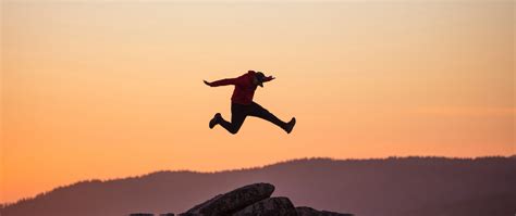 Download wallpaper 2560x1080 jump, cap, sunset, rocks dual wide 1080p ...
