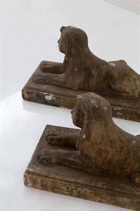 Pair of Egyptian-style gold-coloured sculpted scaiola plaster sphinxes ...