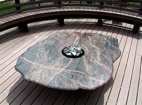 Rock Fire Pit Tables Made From Natural Stone Boulders. 605-224-8089