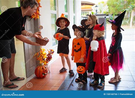 Kids Trick or Treat. Halloween. Child at Door Stock Photo - Image of ...
