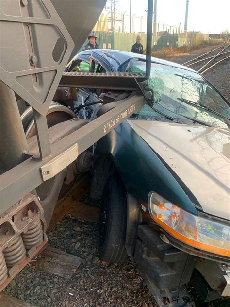Officials: Train hits car in New Haven, causing minor injuries