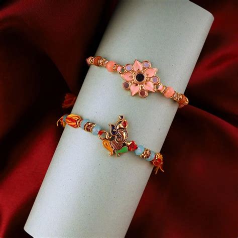 Send Ganesh and Floral Rakhi Set to Canada Online - RKH22-106679 ...
