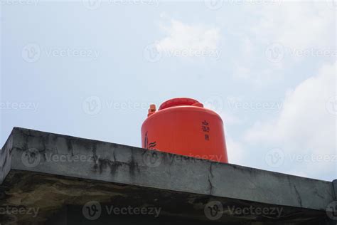 big orange water reservoir on the roof of the house. 20345046 Stock ...