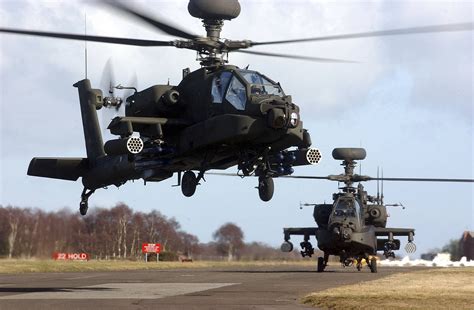 Three of the British Army's new AH64D Apache Longbow helicopters depart ...