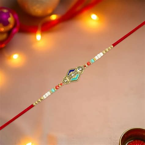 Elegant Geometric Rakhi with Diamond Accents and Multicolor Beaded Thr