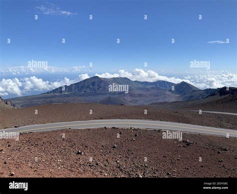 Roadway through high elevation landscape at Haleakala, East Maui Volcano in Hawaiian Island of ...