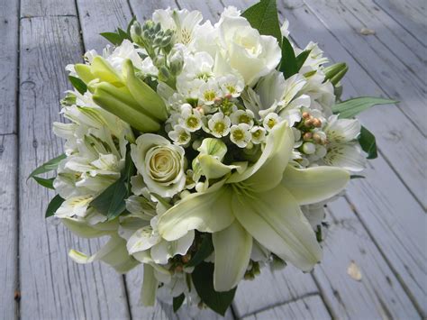 White lily bridal bouquet. | Lily bridal bouquet, Wedding flowers ...