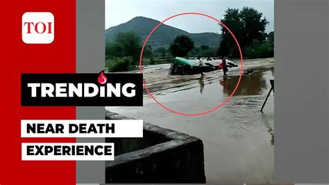 Watch: Bus with 50 passengers loses balance, falls in flooded drain