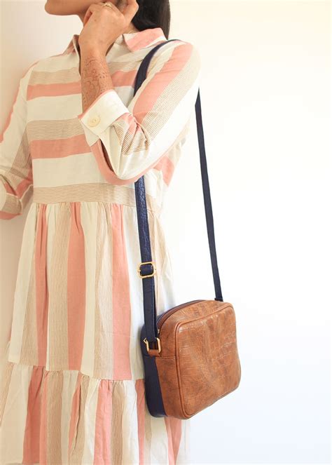 Get Navy Sling Detail Tan Textured Sling at ₹ 1439 | LBB Shop