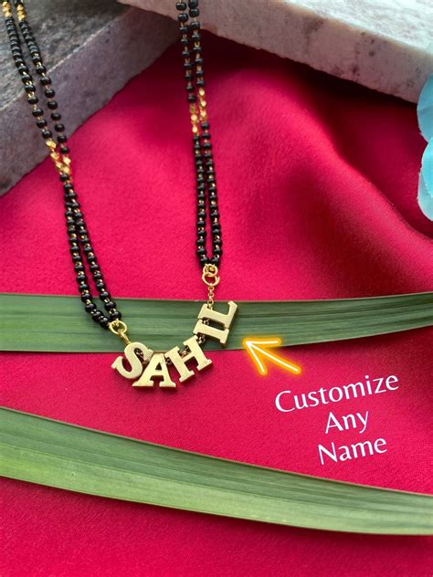 Fancy Name Mangalsutra With 2 Line Black Beads Chain | Short Mangalsut ...