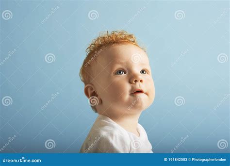 Portrait of Red Headed Baby Looking Up Stock Image - Image of infant ...