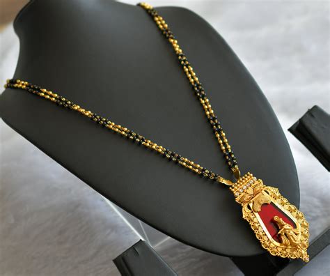 Gold tone kerala style karimani chain with white-red krishna nagapadam ...