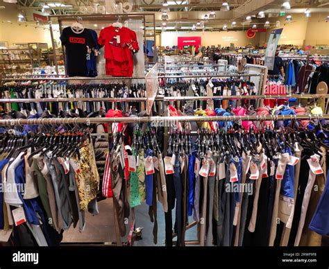 WARSAW, POLAND - JUNE 29, 2023: Clothes selection in a T.K.Maxx store in Poland. T.K.Maxx is a ...
