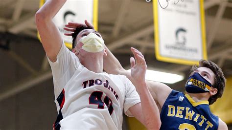 Boys basketball: East Lansing recovers in overtime, tops DeWitt