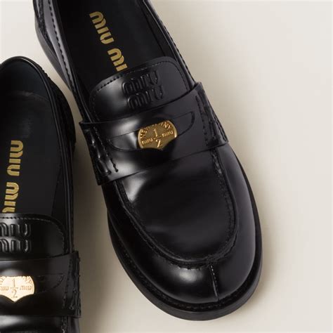 Black Brushed Leather Penny Loafers | Miu Miu