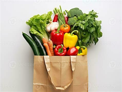 Grocery shopping in paper bag with vegetables on white background ...