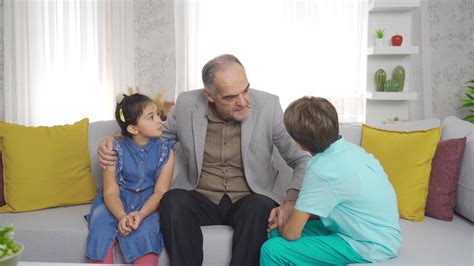 Funny and storyteller grandfather tells his grandchildren. Grandparents ...