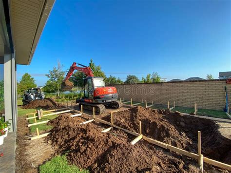 Image result for Backhoe Digging Hole