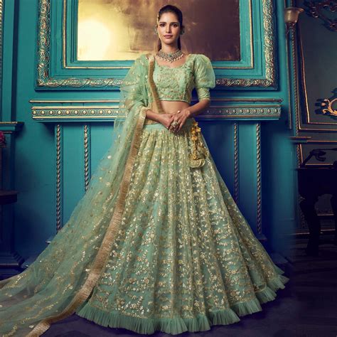 Staring Green Colored Partywear Embroidered Soft Net Lehenga Choli
