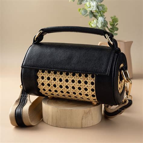 Classic Black Meadow Roller Clutch: Chic Cane & Vegan Leather Design ...