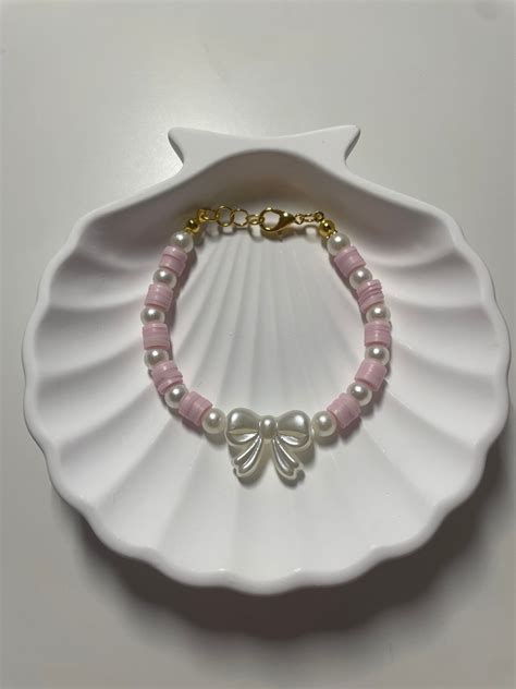 Pearly Bow Bracelet in Pink - Etsy in 2024 | Beads bracelet design ...