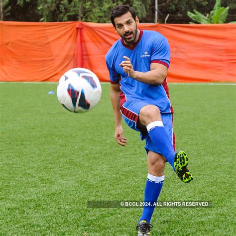 B'wood hunk John Abraham flaunts his skills during a friendly football ...