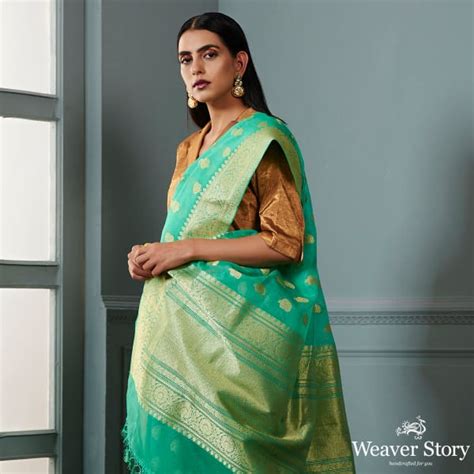 Green banarasi kora saree with beldar border and kairi boota – WeaverStory