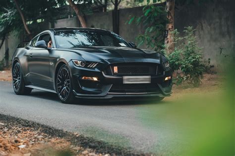 Sleek Black Ford Mustang GT in Gurugram Street · Free Stock Photo