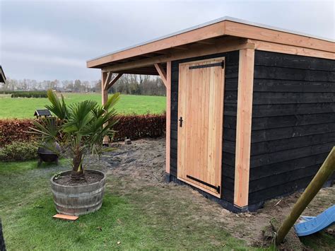 https://cdn.webshopapp.com/shops/34832/files/447035121/schuur-met-overkapping-veessen.jpg