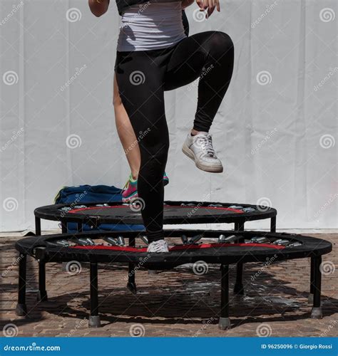 Mini Trampoline Workout: Girl Doing Fitness Exercise in Class at Stock Photo - Image of athlete ...