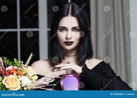 Portrait of Elegant Stylish Brunette Gothic Witch Woman Holding Bottle ...