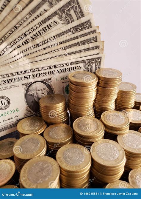 Approach To American Dollars Bills and Mexican Coins of Ten Pesos Stock ...