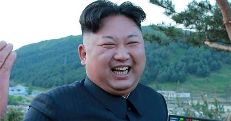 Download Kim Jong - Un Is Smiling And Waving | Wallpapers.com