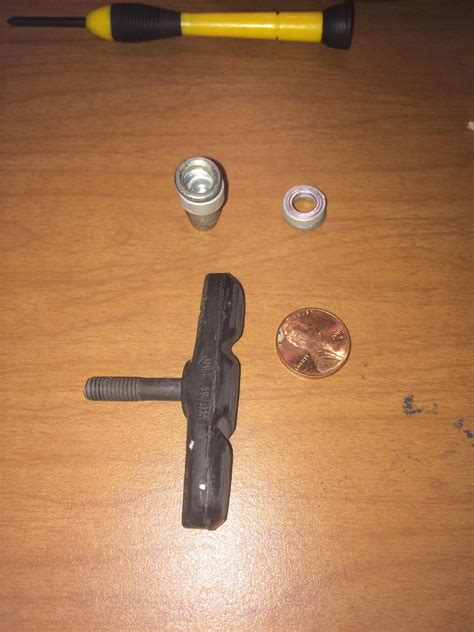 Is it time to replace my brake pads? (penny for scale) If so, please ...