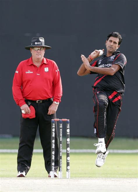 Tanwir Afzal coming in to bowl against Ireland along side umpire Derek ...