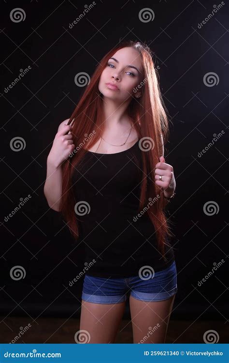 Portrait of a Beautiful Young Red-haired Girl on a Dark Black ...