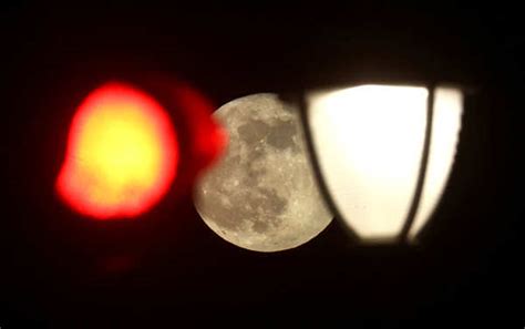 Spectacular pictures of 'pink' supermoon across the world Photogallery ...