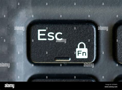 Escape and function lock key on a laptop keyboard Stock Photo - Alamy
