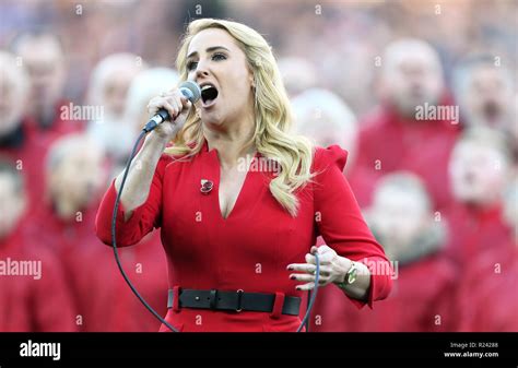 Lizzie Jones sings the national anthem prior to kick-off Stock Photo ...