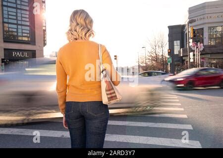 USA Maryland Bethesda Pedestrian safety woman crossing in a crosswalk ...
