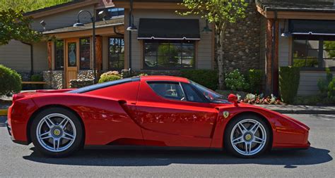 Download Stunning Red Ferrari Enzo on Display Wallpaper | Wallpapers.com