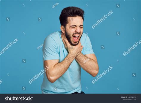 Man Choking Himself Against Blue Background Stock Photo 1421345930 ...