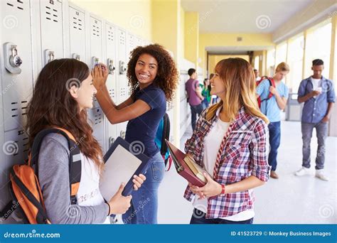 Group of Female High School Students Talking by Lockers Stock Image ...