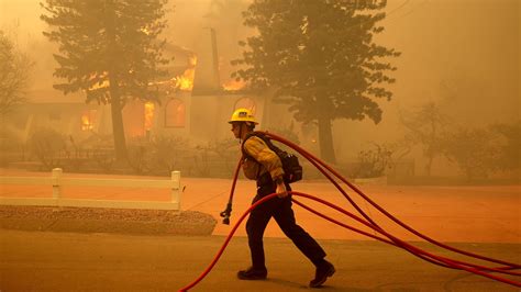 Southern California wildfire engulfs homes, moving 'dangerously fast'