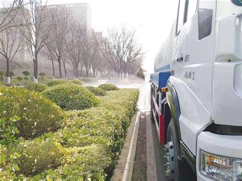 淄博冲洗雪后城市道路和绿植凤凰网山东_凤凰网