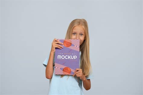 Kid holding book Images - Free Download on Freepik