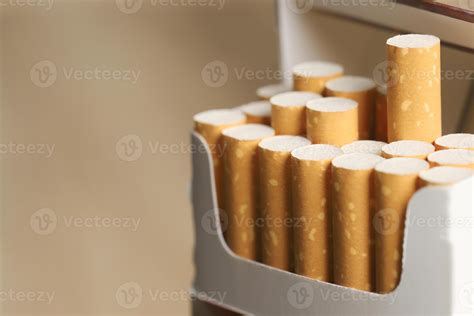 peel it off Cigarette pack prepare smoking on white wooden background ...