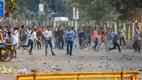 Delhi: Stone-pelting in Maujpur during CAA stir, police lob tear gas ...