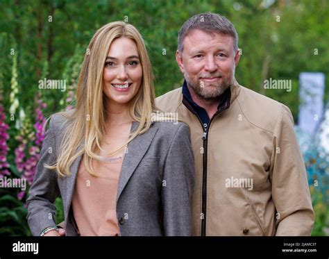 Film Director, Producer, screenwriter and businessman, Guy Ritchie with his wife, Jacqui Ainsley ...